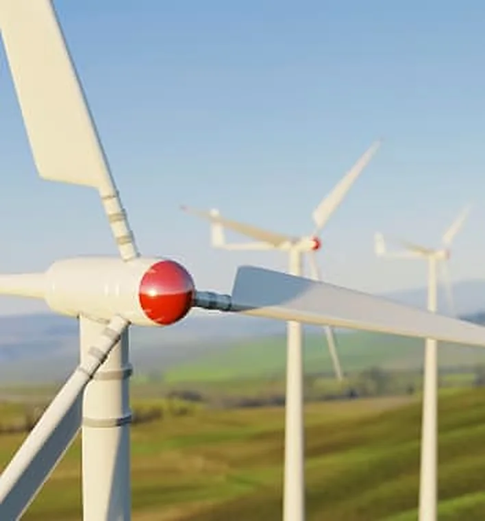 Wind turbines on a green hillside